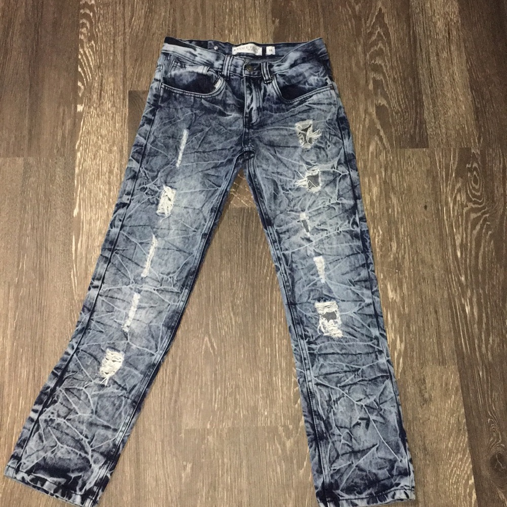 Ripped destresed blue and light blue jeans